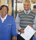 Lettie Miya, dispatch clerk, with Benjamin Mlangeni, technical sales,  the guide for  the factory tour
